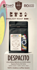A coffee bag product display on a pedestal with branding for FiveO and SCAs 85, featuring the Despacito Colombia/Brazilia/Costa Rica coffee beans.