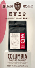 A package of Five O Coffee's Columbia Excelso Paramo coffee beans, displayed on a white pedestal. The product is shown in a black stand-up pouch with a white and red label.