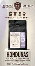 A package of FiveO Omnilight Roast Honduras coffee beans displayed on a white pedestal. The product packaging is a black stand-up pouch with a white and purple label. The best single origin speciality coffee frm honduras
