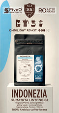 A bag of FiveO Omnilight Roast Sumatra Linting G1 coffee beans displayed on a white pedestal. The packaging features a black pouch with a white and blue label, set against a light beige background with blue and brown graphic elements and text detailing the product's origin and roast.