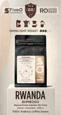 A coffee bag labeled 'RWANDA BUMBAGO' displayed on a pedestal with branding and roast information above it. The product appears to be a matte black coffee pouch with a cream and tan label. The best single origin speciality coffee from rwanda.